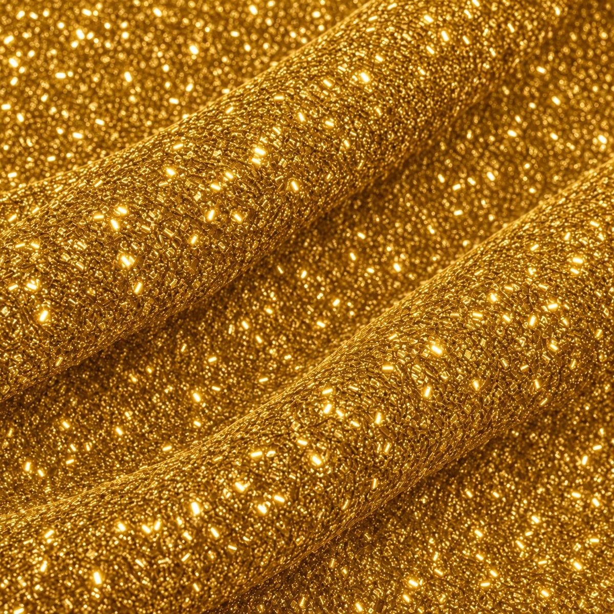 Tela esponjillón dorado en pliegues ondulados, con detalle de su textura